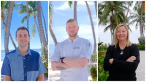 Islamorada Resort Collection's newest employees Sean Leister, Charles Trexel, and Stacy Peringer pose for beachfront headshots. 