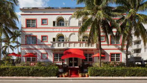 Courtesy Faena A front shot of the Faena Hotel Miami Beach in Miami, surrounded by palm trees.