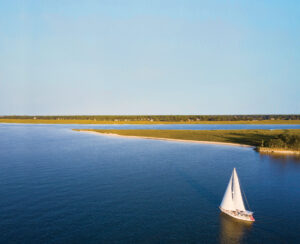 A sail boat floats across the water in Hilton Head Island, S.C. 