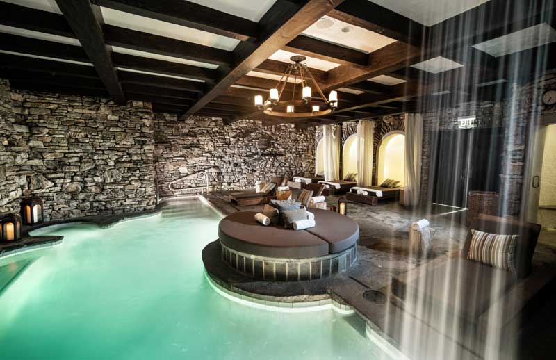 A pool and loungers alongside it.