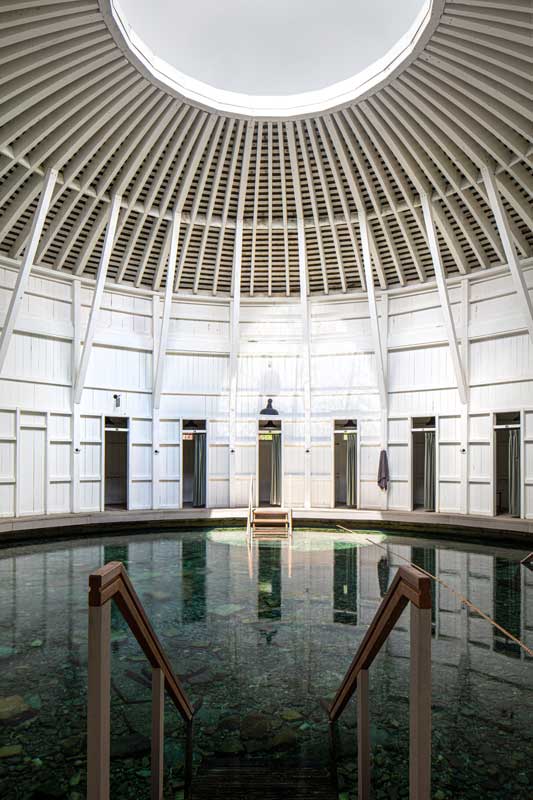 A warm spring and a staircase leading to it.