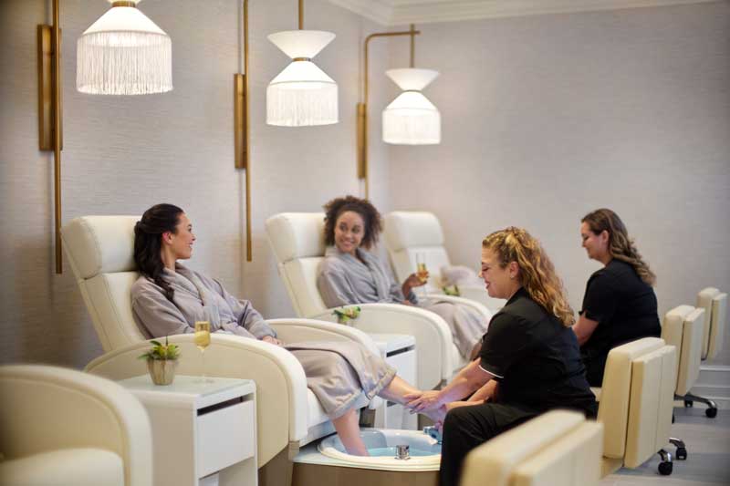 People getting a pedicure at a spa.