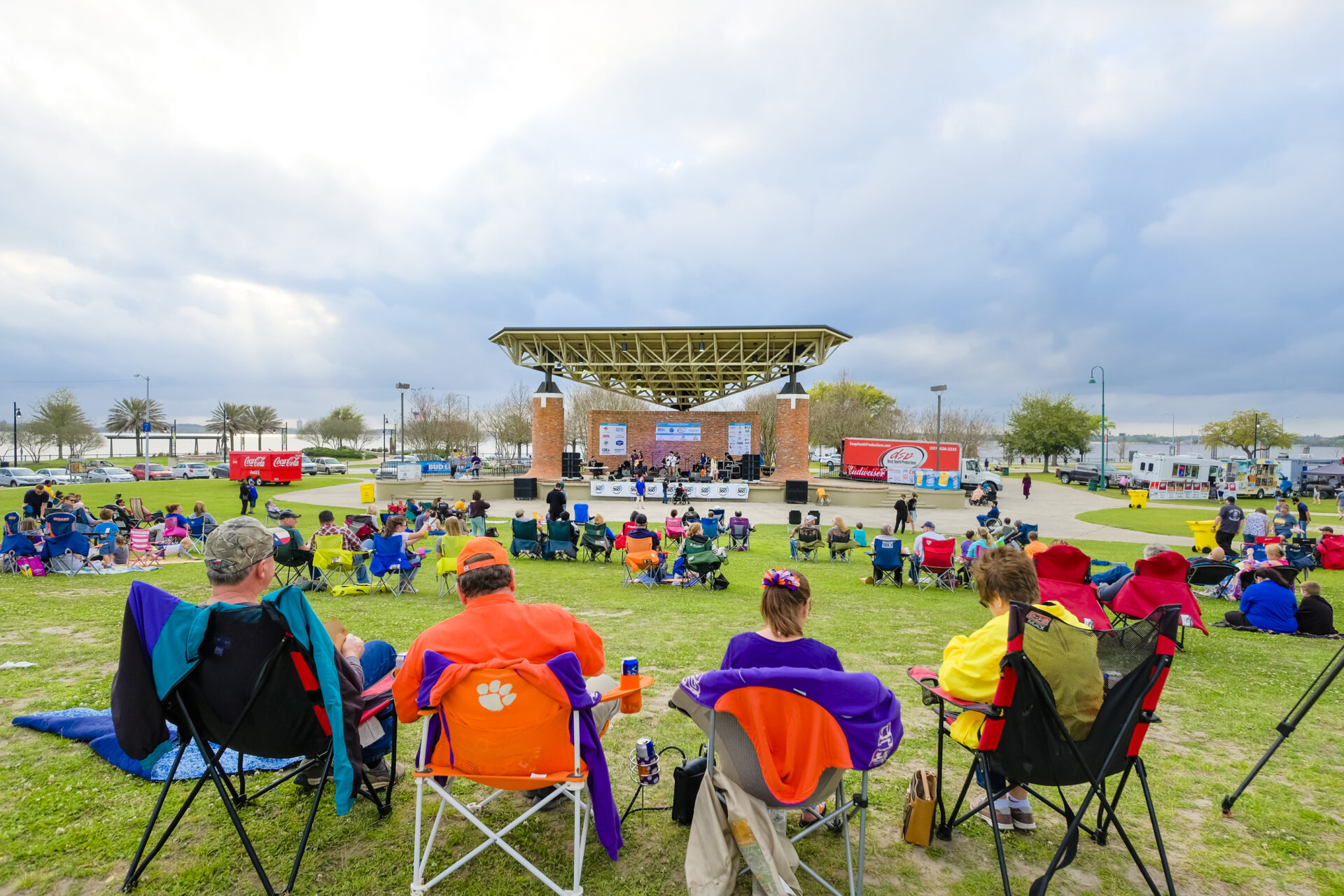People sitting around the Louisiana Arcade Amphitheater in lawn chairs.