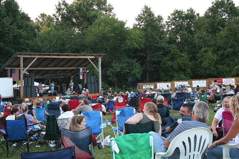 People sitting in lawn chairs at the Cedar Hill amphitheater.