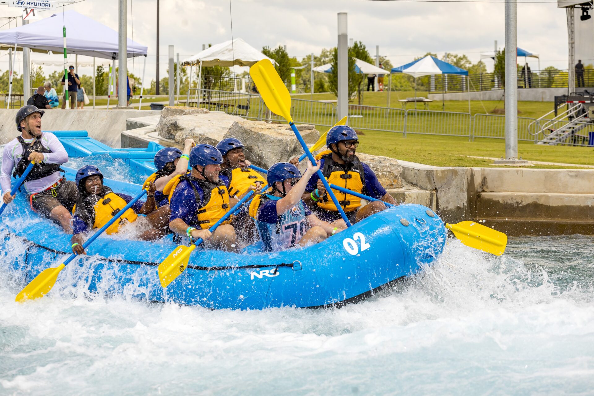 A group of people whitewater rafting.