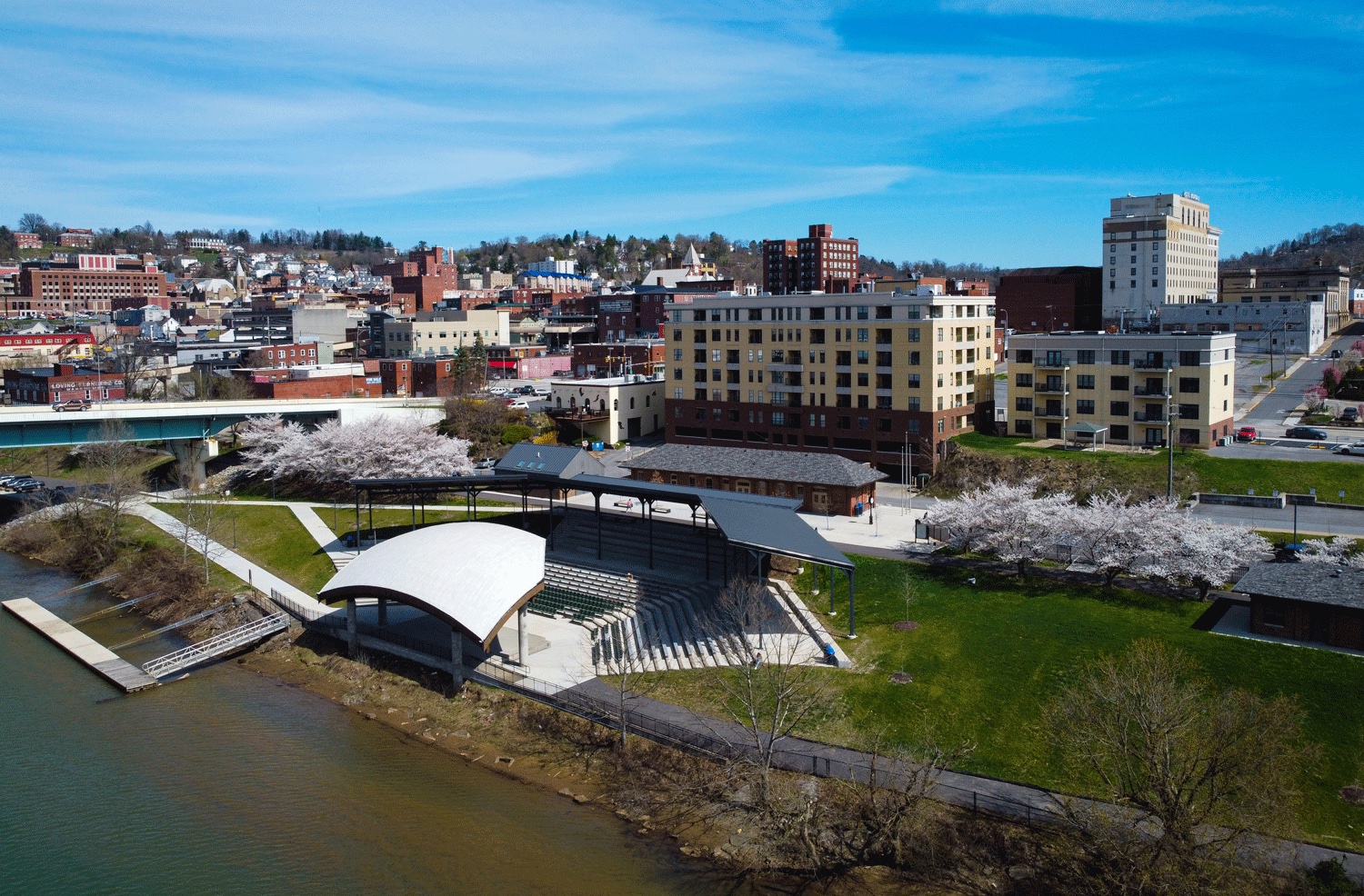 A drone shot of Ruby Amphitheater by the water.