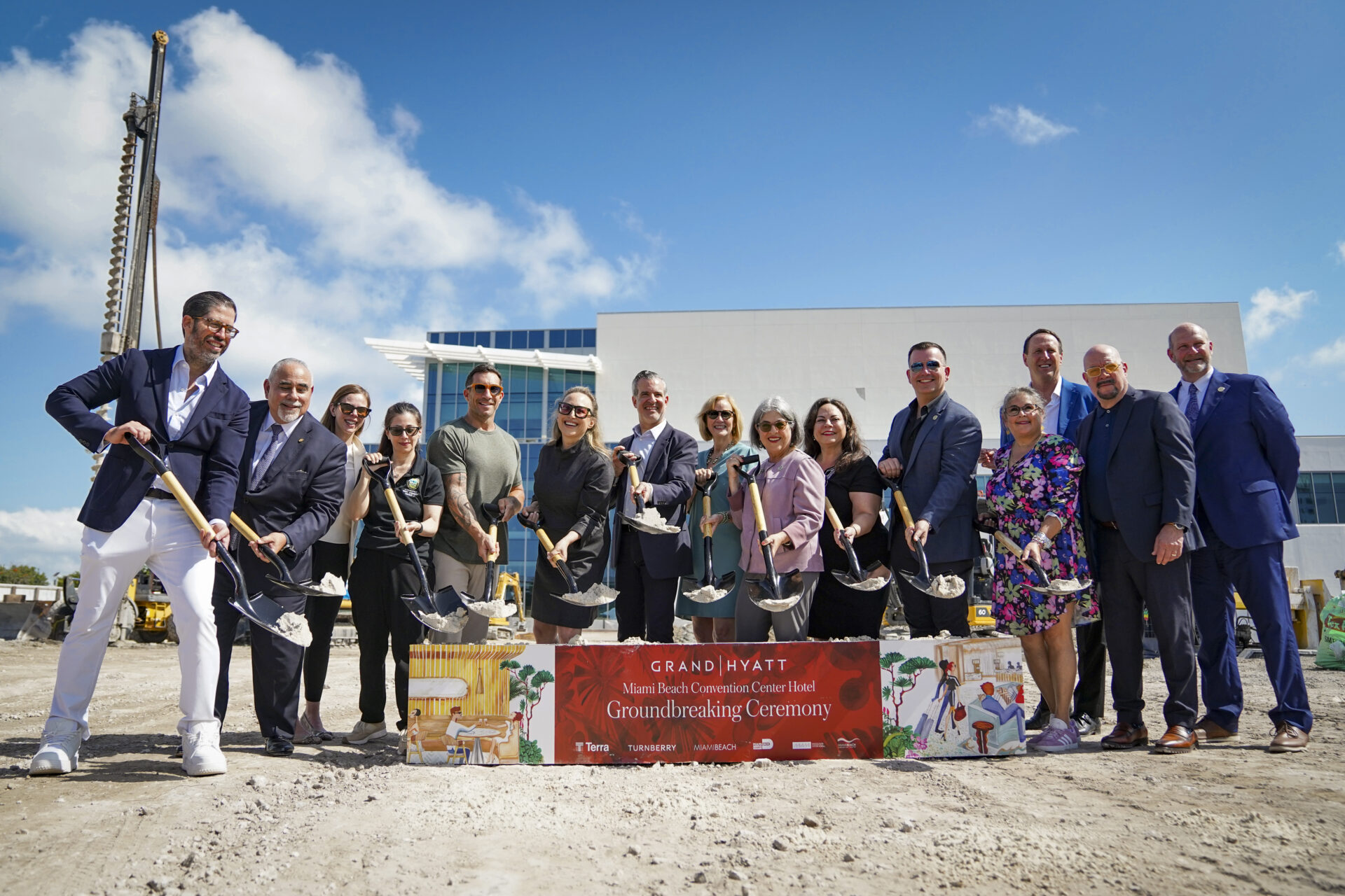 Civic leaders, developers, and hospitality executives posing with shovels at the groundbreaking of Grand Hyatt Miami Beach