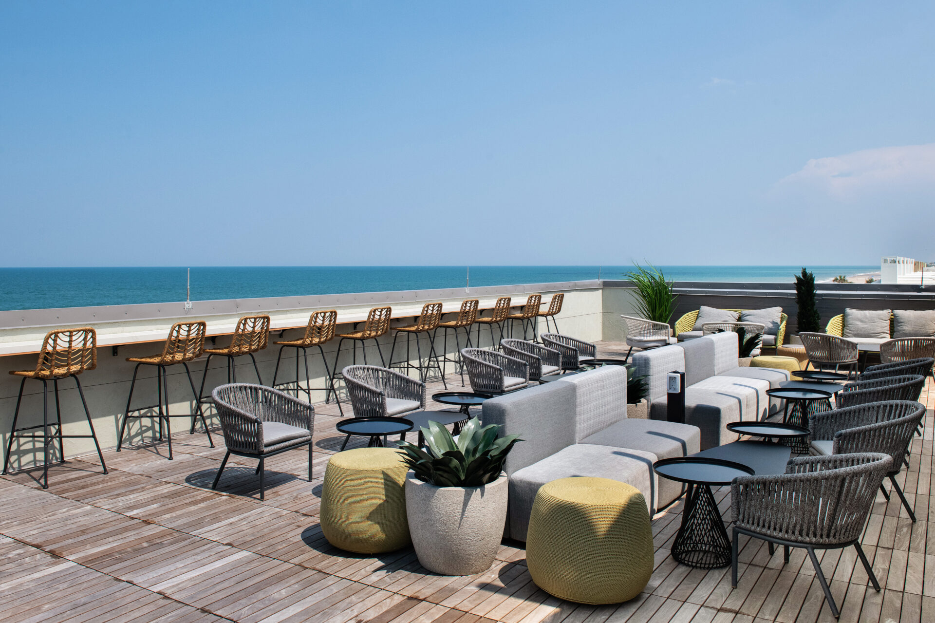 An outdoor rooftop restaurant facing the ocean.