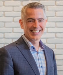 A headshot of Gregg Hilker