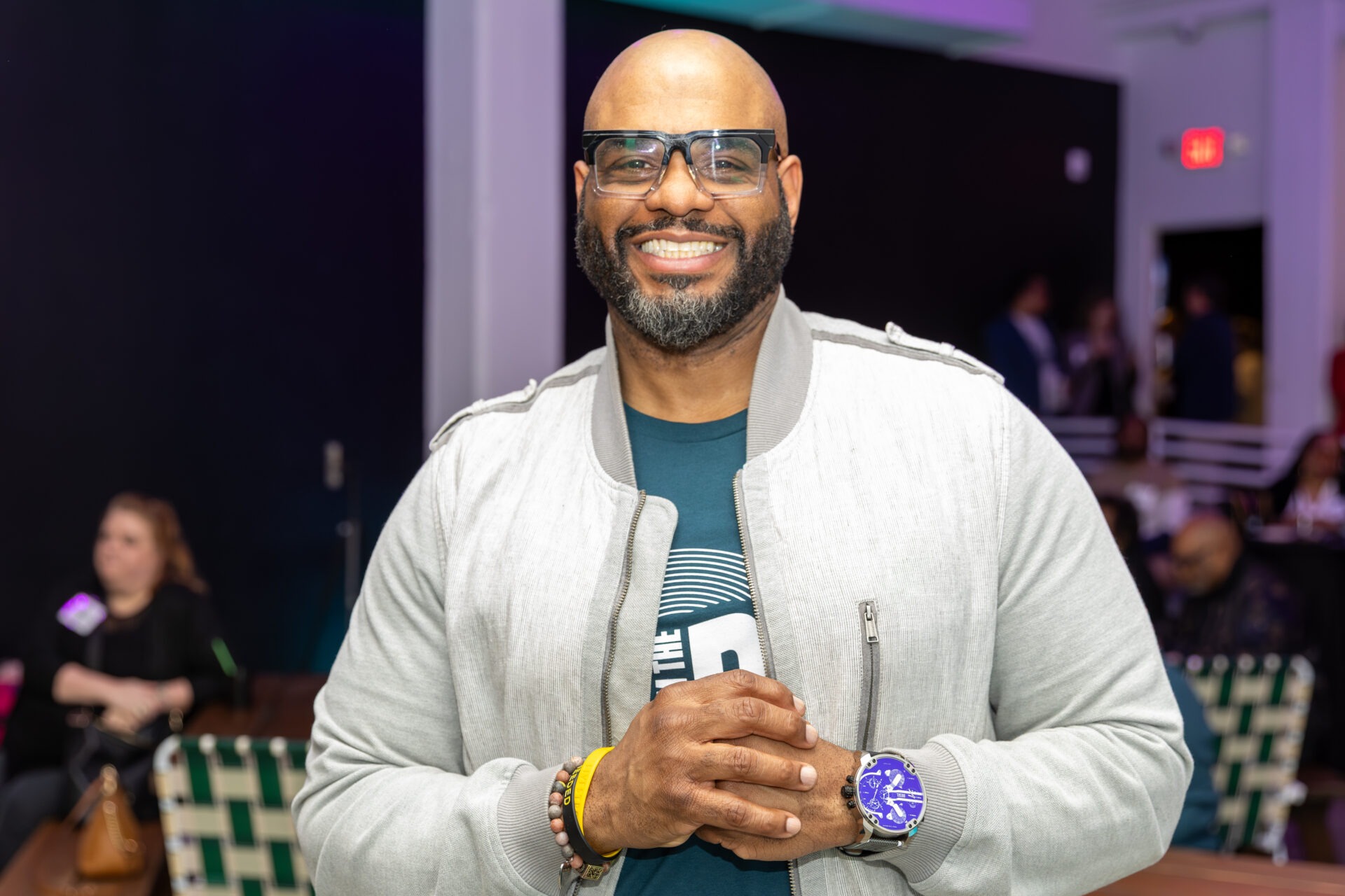 A headshot of Kireem Swinton in a light-colored bomber jacket.
