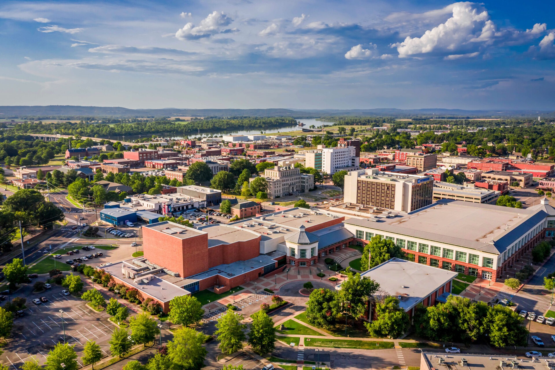 An aerial shot of Fort Smith, Arkansas boasts beautiful riverfront scenery, a charming downtown, a convention center, and unique historic attractions.
